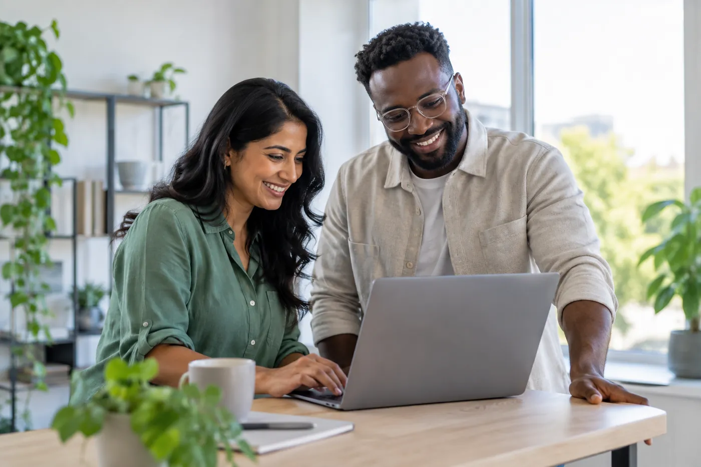Two business partners looking at a laptop together